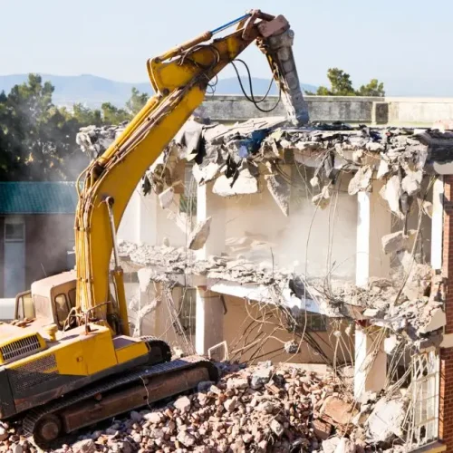 equipment wrecking a building