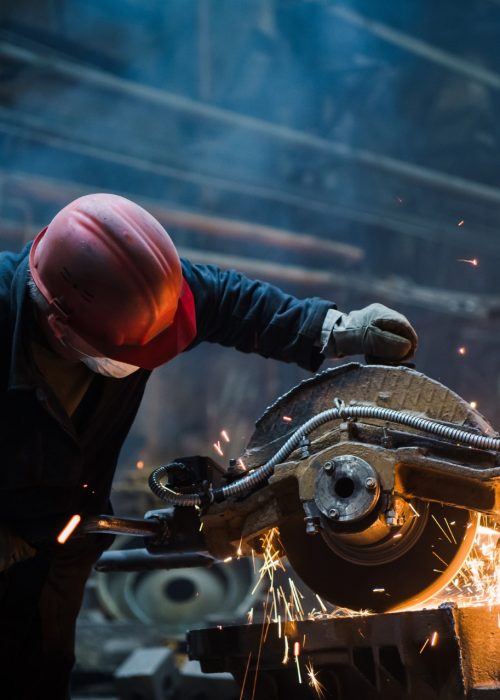 employee-grinding-steel-with-sparks-focus-on-grind